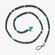 Experience unmatched spirituality and elegance with our Elegance Tasbih, crafted from the rarest Black Ebony and Apatite gemstones. Each of the 100 beads, accentuated with silver, not only serves for tasbih but transforms seamlessly into a necklace or bracelet, elevating your spiritual journey with grace.