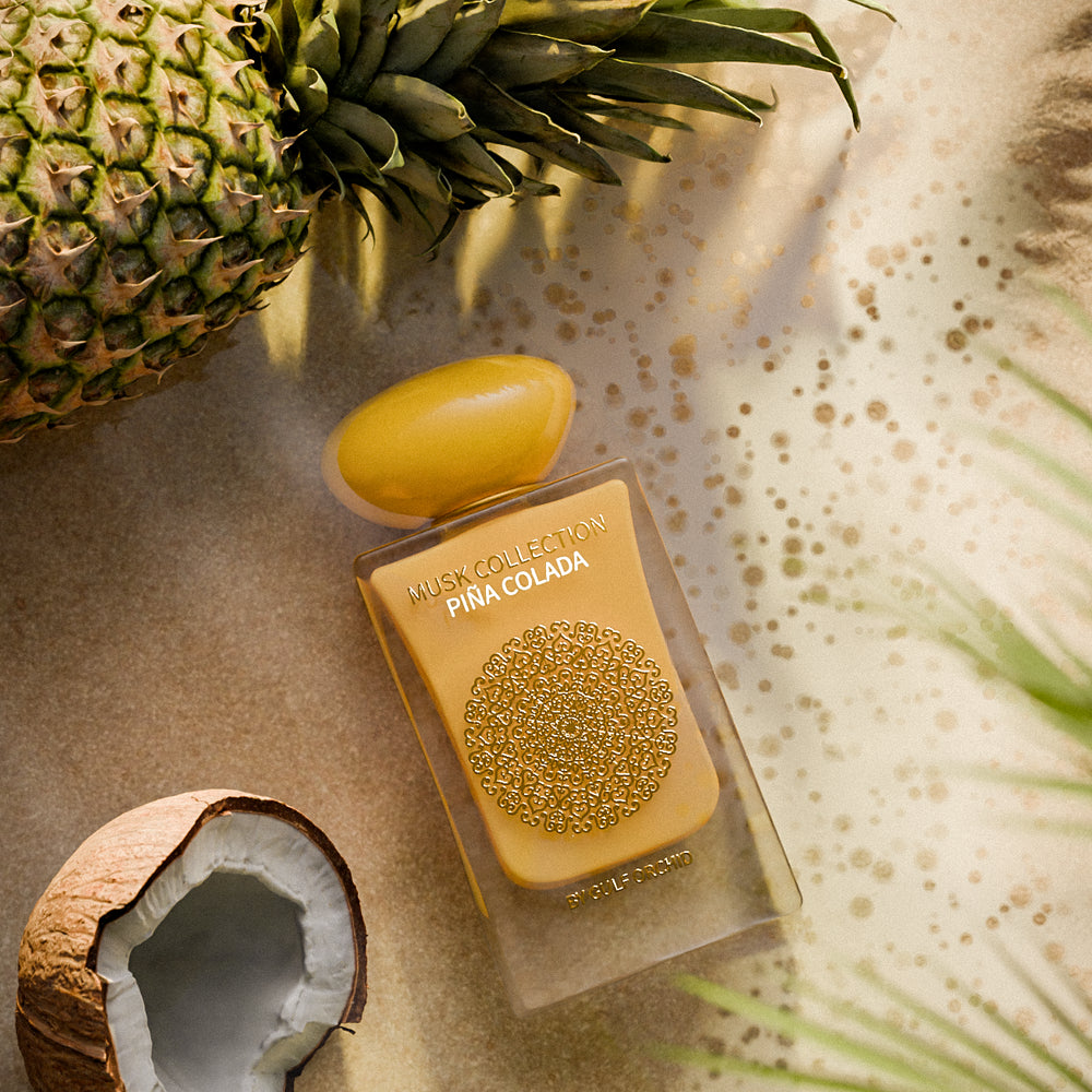 Piña Colada - A tropical musky fruity fragrance with juicy pineapple, creamy coconut, and golden vanilla musk, capturing the essence of sun-kissed skin and endless summer bliss