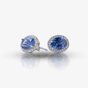 Add a touch of timeless luxury to your jewelry collection with these stunning Sapphire Elegance Silver Stud Earrings. Crafted in 925 sterling silver, they feature radiant blue sapphire-hued gemstones surrounded by a delicate halo of shimmering stones. Perfect for elevating any look, these earrings blend classic sophistication with modern charm.