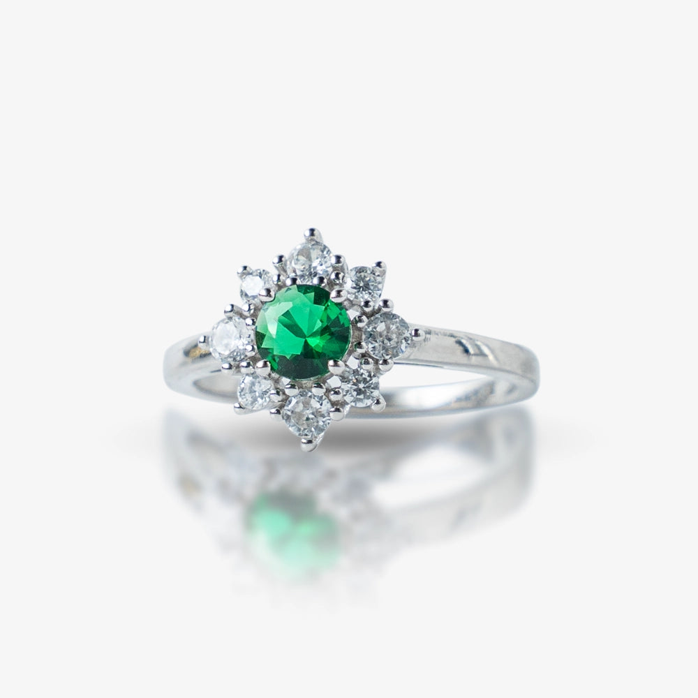 Elegant and timeless, this Sterling Silver 925 Emerald & Diamond Halo Ring features a stunning green stone at its center, surrounded by a sparkling halo of white stones. Its vintage-inspired design adds a royal touch to any look.