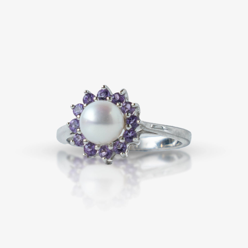 Timeless and elegant, this Sterling Silver 925 Pearl & Amethyst Flower Ring features a beautiful round pearl at the center, surrounded by a halo of sparkling purple stones. Its floral-inspired design adds a touch of sophistication to any look.