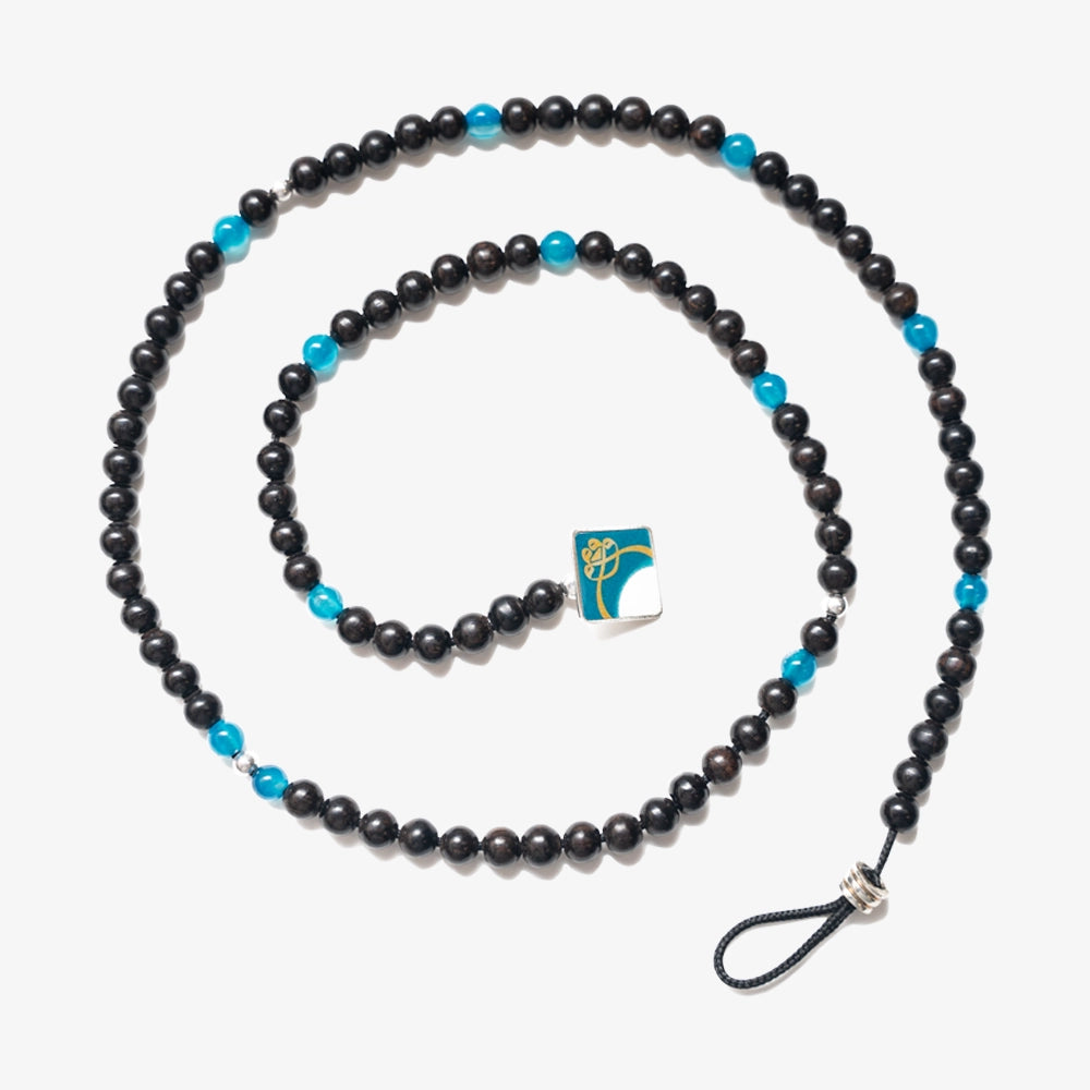 Experience unmatched spirituality and elegance with our Elegance Tasbih, crafted from the rarest Black Ebony and Apatite gemstones. Each of the 100 beads, accentuated with silver, not only serves for tasbih but transforms seamlessly into a necklace or bracelet, elevating your spiritual journey with grace.