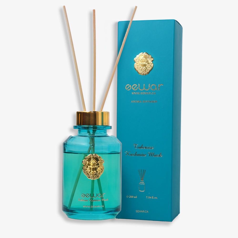 A sleek, premium glass bottle with a metallic logo, filled with Sewar Tuberose & Kashmir Musk Reed Diffuser. The diffuser is adorned with elegant reeds, showcasing the fresh and floral fragrance. The design adds a touch of sophistication and luxury, perfect for enhancing the atmosphere of any spa