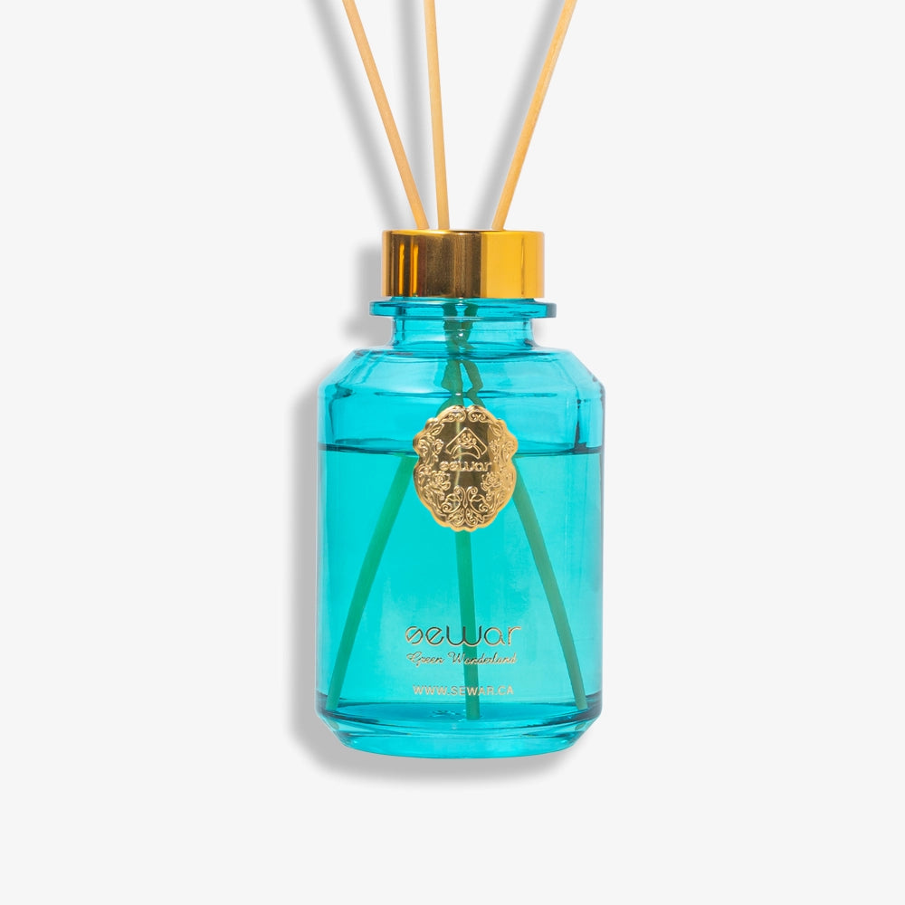 Transform your space with the Sewar Green Wonderland Reed Diffuser. This luxurious glass bottle diffuser features an exquisite metallic logo and a refined fragrance blend of jasmine, tuberose, and powdery accords, offering an elegant and long-lasting aroma.